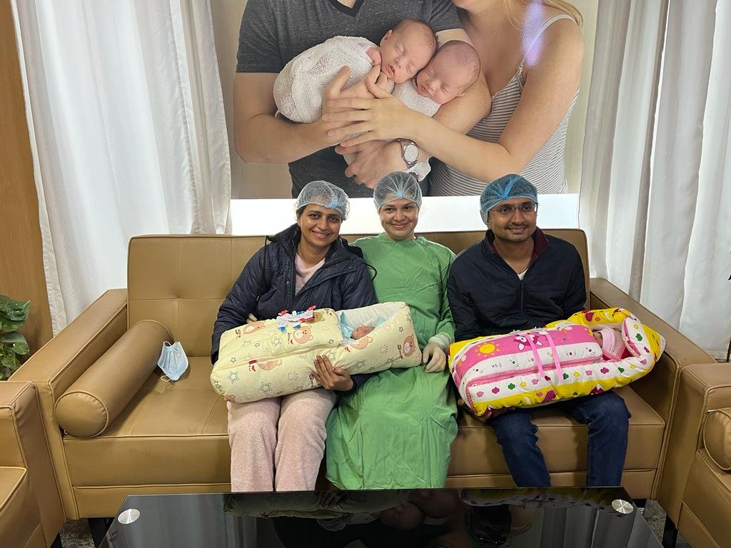 Family with twins and doctor