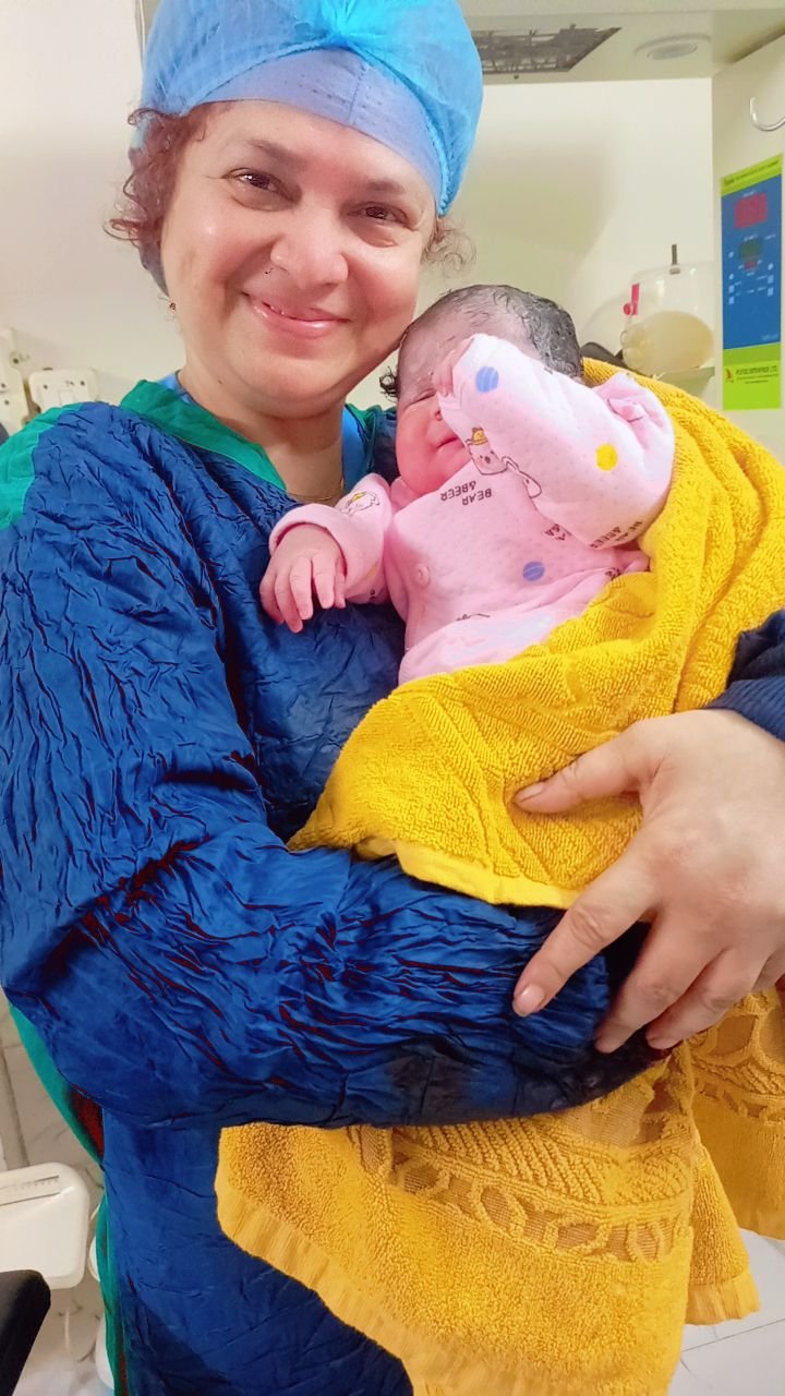 Nurse holding a newborn